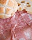 Bread roll, cheese and mortadella. Royalty Free Stock Photo