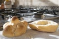 Bread roll half cut on a stove-top Royalty Free Stock Photo