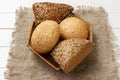 Bread rolls in the basket on rustic wooden background Royalty Free Stock Photo