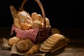 Bread and rolls in wicker basket on burlap sack Royalty Free Stock Photo