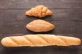 Bread rolls on wooden background from top view Royalty Free Stock Photo