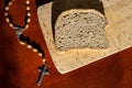 Bread and rosary beads lent concept before easter .