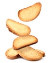 Bread rusks falling on a heap on a white background, levitating crackers. Isolated Royalty Free Stock Photo
