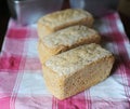 Bread on rye leaven without yeast. Three fresh loaves on a checkered tablecloth Royalty Free Stock Photo