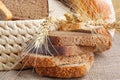 Bread from rye and wheat flour of rough grinding in wicker basket Royalty Free Stock Photo