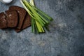 Bread with salt, green onions with water droplets