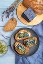 Bread sandwiches with blue lavender cheese and mustard microgreen on blue, top view, close up Royalty Free Stock Photo