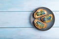 Bread sandwiches with blue lavender cheese and mustard microgreen on blue, top view, copy space Royalty Free Stock Photo