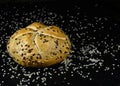 Bread with seeds. Seven-grain bread, round bun with rye, wheat, barley grains, flaxseed, sesame and sunflower seeds, soy. Healthy Royalty Free Stock Photo