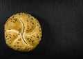 Bread with seeds. Seven-grain bread, round bun with rye, wheat, barley grains, flaxseed, sesame and sunflower seeds, soy. Healthy Royalty Free Stock Photo