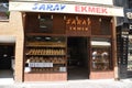 A bread shop, outside of the business on the street