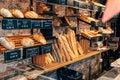 Bread shop showcase. Various loaves of bread on the shelves in the store.