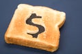 Bread slice with dollar sign