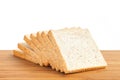 Bread slice on wooden table isolated in white background Royalty Free Stock Photo