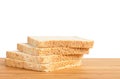 Bread slice on wooden table isolated in white background Royalty Free Stock Photo
