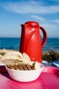 Bread slices and thermos on beach