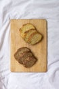 Bread slices on a wooden table. Integral brads. Corn bread. Selective focus Royalty Free Stock Photo