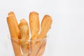 Bread stick on cup isolated on white Royalty Free Stock Photo