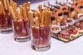 Bread sticks with a prosciutto in a glass