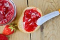 Bread with strawberry jam and berries on board Royalty Free Stock Photo