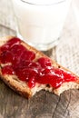 Bread with strawberry jam bited vertical Royalty Free Stock Photo