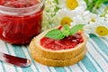 Bread with strawberry jam and daisies on a napkin Royalty Free Stock Photo