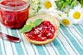 Bread with strawberry jam and knife on a napkin Royalty Free Stock Photo