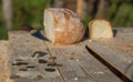Bread on a table with coins and knife. Defocused