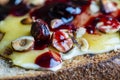 Bread toast with butter, roasted hazelnuts, honey, berry jam on plate , closeup Royalty Free Stock Photo