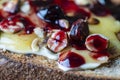 Bread toast with butter, roasted hazelnuts, honey, berry jam on plate , closeup Royalty Free Stock Photo