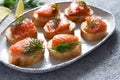 Bread toast with butter and salmon for a snack. Breakfast. Fish canapes on the table Royalty Free Stock Photo