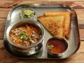 Bread toast with Misal, Poona misal or Puneri Misal is a special and popular item in Pune, Maharashtra. The dish is eaten for