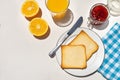 Bread toast with orange juice and jam on white background Royalty Free Stock Photo