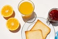 Bread toast with orange juice and jam on white background Royalty Free Stock Photo