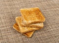 Bread Toasts on Rustic Background, Toasted Sandwich Square Slices, Loaf Pieces for Toast on Brown Tablecloth Royalty Free Stock Photo