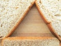 Bread triangle on wooden background