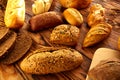 Bread varied mix on golden aged wood table Royalty Free Stock Photo