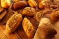 Bread varied mix on golden aged wood table Royalty Free Stock Photo