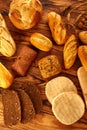 Bread varied mix on golden aged wood table Royalty Free Stock Photo