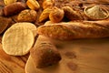 Bread varied mix on golden aged wood table Royalty Free Stock Photo