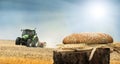 Bread and wheat cereal crops.Traktor on the background Royalty Free Stock Photo