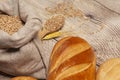 Bread with wheat ears, grains, on a wooden table top view. Royalty Free Stock Photo