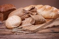 Bread and wheat ears on sacking Royalty Free Stock Photo