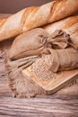 Bread and wheat ears on sacking Royalty Free Stock Photo