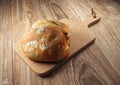 Bread on wooden cutting board