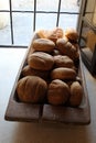 Bread in a wooden trough on a windowsill.