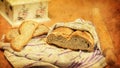 Bread wrapped in cloth, bread slices, rolling pin, decoupage box. Royalty Free Stock Photo