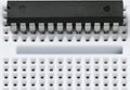 Breadboard and microchip closeup - electronic component for digital equipment, concept for development of electric computer