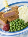 Breadcrumbed Luncheon Meat with Mashed Potato Peas Royalty Free Stock Photo