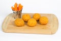 Breaded Chicken Ball on a wooden carrot